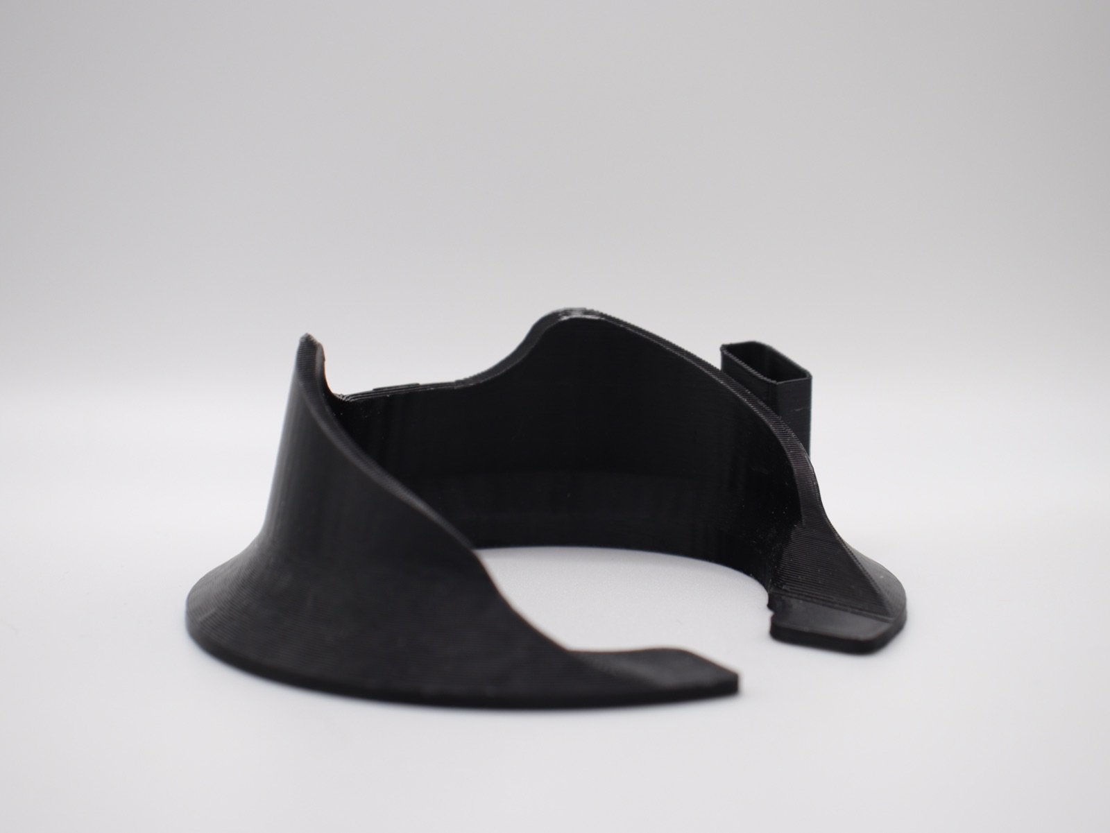 Black glass topper stand viewed from the opposite side.